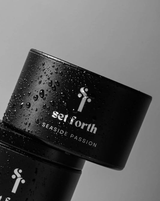 Seaside Passion candle in matte black tin.