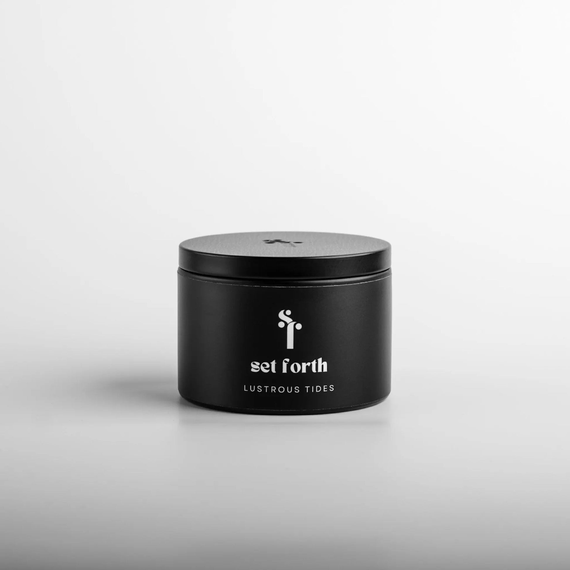 Lustrous Tides candle in matte black tin.