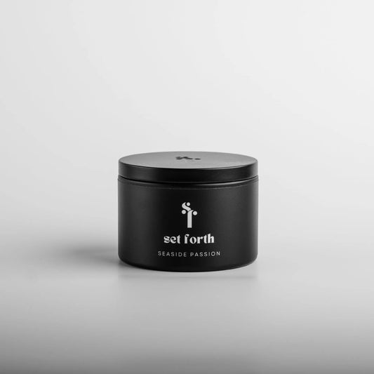 Seaside Passion candle in matte black tin.